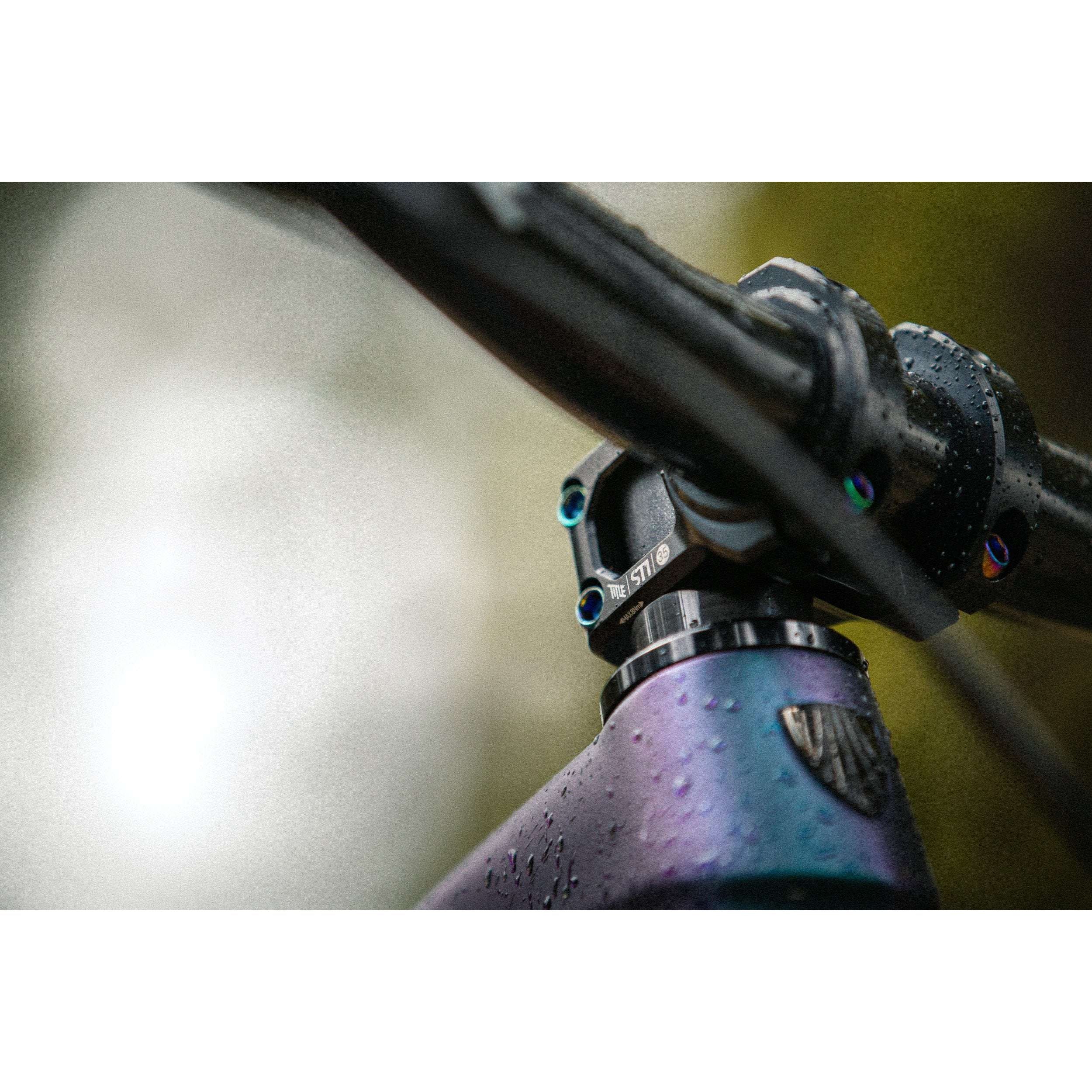 ST1 35mm clamp - Title MTB oil slick rainbow bolts mounted on bike Casey Brown
